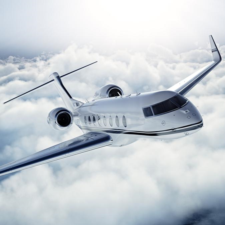 Private jet flying in the clouds